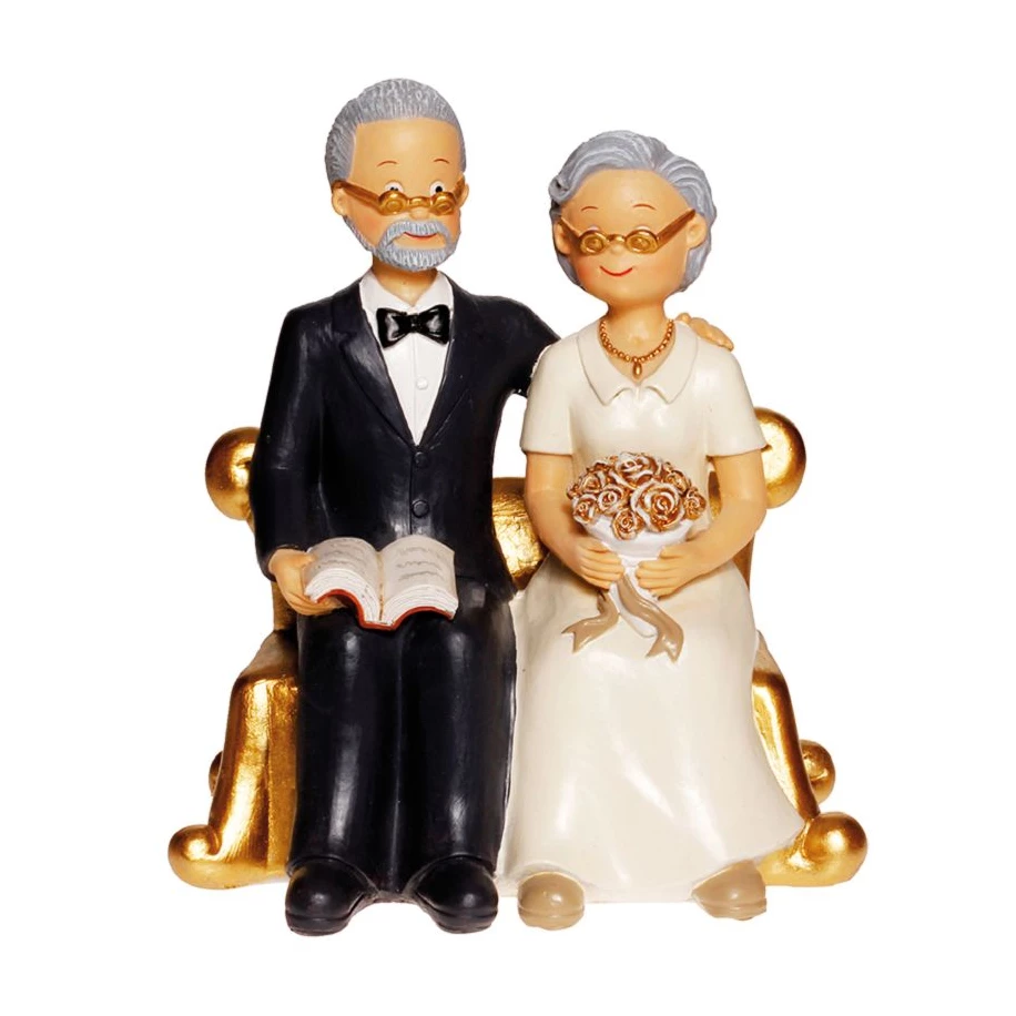 Couple de Seniors sur fauteuil doré H. 15cm - pièce